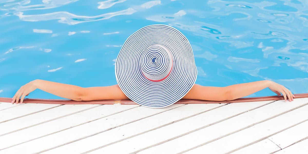 lady relaxing in award pool 